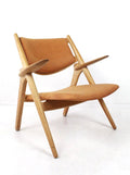 Sawbuck armchair CH28 by Hans J Wegner for Carl Hansen & Son - Collectors - Net.Work