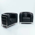 Zanotta Onda black round leather chairs, inspired by le Corbusier, Italy, set 2 - COLLECTORS RDAM
